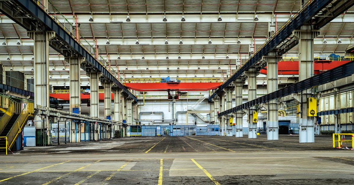 Expansive industrial warehouse interior showcasing steel framework and spacious layout for diverse manufacturing needs.